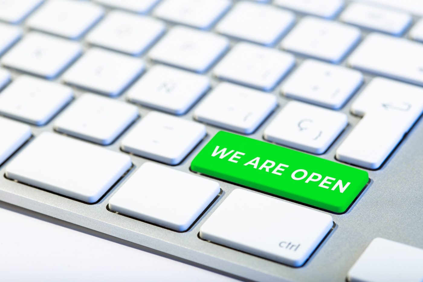 We are open concept. Keyboard with green key and text